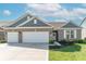 Charming home featuring a two-car garage, manicured lawn, and classic brick and shingle exterior at 6229 Farlin Dr, Whitestown, IN 46075