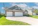 Beautiful home with a manicured lawn, attached garage, and a long concrete driveway at 6229 Farlin Dr, Whitestown, IN 46075