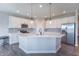 Modern kitchen featuring a large island, stainless steel appliances, and white cabinets at 6229 Farlin Dr, Whitestown, IN 46075