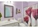 Updated bathroom with a modern mirror, decorative shower curtain, and lilac colored walls at 6241 Colonial Dr, Whitestown, IN 46075