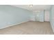 Bright, carpeted bonus room with neutral walls presents an open area for relaxation or entertainment at 6241 Colonial Dr, Whitestown, IN 46075