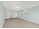 Spacious, carpeted bonus room with neutral walls and ample natural light creates a versatile living space at 6241 Colonial Dr, Whitestown, IN 46075