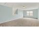 Neutral bonus room with carpet, stairs, and a window for natural light provides a versatile space for occupants at 6241 Colonial Dr, Whitestown, IN 46075