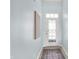 Entryway with natural lighting, and white front door with a decorative glass insert, and a patterned rug at 6241 Colonial Dr, Whitestown, IN 46075