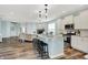 Bright kitchen featuring white cabinetry, stainless appliances, granite counters, and a breakfast bar with seating at 6241 Colonial Dr, Whitestown, IN 46075