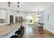 Kitchen and dining area featuring stainless appliances, granite counters, and a breakfast bar with seating at 6241 Colonial Dr, Whitestown, IN 46075