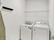 Laundry room with white washer and dryer at 6241 Colonial Dr, Whitestown, IN 46075