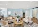 Inviting living room featuring hardwood floors, neutral decor, and a seamless flow into other living spaces at 6241 Colonial Dr, Whitestown, IN 46075