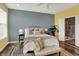 Inviting main bedroom with a tray ceiling, natural light, and an attached ensuite bathroom with shower at 6241 Colonial Dr, Whitestown, IN 46075