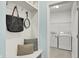 Entryway mudroom with bench, storage and view to the laundry room at 6241 Colonial Dr, Whitestown, IN 46075