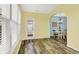 Bright sun room featuring wood-look floors, large windows, and access to the outdoors at 6241 Colonial Dr, Whitestown, IN 46075