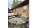 Exterior view of the back patio, showing a small step-down area and exterior access at 645 Boulder Rd, Indianapolis, IN 46217