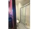 Bright bathroom showcasing a walk-in shower and patterned wallpaper, providing a clean design at 645 Boulder Rd, Indianapolis, IN 46217