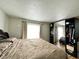 Bright bedroom with wood laminate flooring, large closet, and neutral wall color at 645 Boulder Rd, Indianapolis, IN 46217