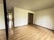 Simple bedroom featuring wood-look floors and closet, offering a comfortable living space at 645 Boulder Rd, Indianapolis, IN 46217
