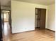 Neutral bedroom with a closet and wood-look floors, offering a blank canvas for personalization at 645 Boulder Rd, Indianapolis, IN 46217