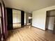 Spacious bedroom with a large mirrored wardrobe and wood-look flooring, providing ample storage at 645 Boulder Rd, Indianapolis, IN 46217