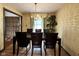 Traditional dining room boasts a chandelier, decorative wallpaper, and ample seating at 645 Boulder Rd, Indianapolis, IN 46217