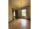 Dining room features a chandelier, patterned wallpaper and a view to the front yard at 645 Boulder Rd, Indianapolis, IN 46217