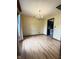 Charming dining room featuring hardwood floors, a chandelier, and light-colored wallpaper at 645 Boulder Rd, Indianapolis, IN 46217