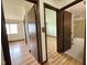 Hallway view with multiple entryways, showcasing the home's layout and access to different rooms at 645 Boulder Rd, Indianapolis, IN 46217
