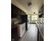Functional kitchen featuring stainless steel appliances and dark cabinets at 645 Boulder Rd, Indianapolis, IN 46217