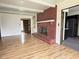 Living room featuring a cozy fireplace and a view into the kitchen and front entry at 645 Boulder Rd, Indianapolis, IN 46217