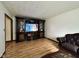 Cozy living room features wood laminate flooring, and an entertainment center at 645 Boulder Rd, Indianapolis, IN 46217
