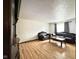Bright living room with wood laminate flooring, neutral paint, and a comfortable seating area at 645 Boulder Rd, Indianapolis, IN 46217