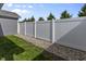 A fenced yard offers privacy, with manicured gravel along the fence line, complementing the green grass at 6738 Fox Club Ln, Brownsburg, IN 46112