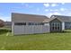 This backyard features a well-maintained lawn and privacy fence, perfect for outdoor entertaining and relaxation at 6738 Fox Club Ln, Brownsburg, IN 46112