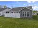 The property boasts a spacious, fenced backyard with lush green grass, ideal for recreation and privacy at 6738 Fox Club Ln, Brownsburg, IN 46112