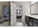 View of bathroom showing a shower, double vanity and connection to the main bedroom at 6738 Fox Club Ln, Brownsburg, IN 46112