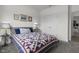 Cozy bedroom featuring a bed with a quilt and neutral decor at 6738 Fox Club Ln, Brownsburg, IN 46112