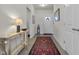 Bright foyer with neutral walls, hardwood floors, rug, and a welcoming atmosphere at 6738 Fox Club Ln, Brownsburg, IN 46112