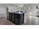 Open kitchen with breakfast bar, stainless steel appliances, sink, and access to living room at 6738 Fox Club Ln, Brownsburg, IN 46112