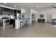 Contemporary kitchen with dark cabinets, stainless appliances, and open access to the living area at 6738 Fox Club Ln, Brownsburg, IN 46112