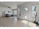 Bright living room boasts hardwood floors, neutral paint, and natural light from large windows at 6738 Fox Club Ln, Brownsburg, IN 46112