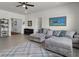 Open living room featuring a sectional sofa, bright art, and ample natural light at 6738 Fox Club Ln, Brownsburg, IN 46112