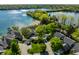 Aerial view of lakefront community with a private sandy beach and lots of mature landscaping at 7849 Clearwater Cove Dr, Indianapolis, IN 46240