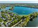 Expansive lakefront views, showcasing residential homes with access to private docks and scenic surroundings at 7849 Clearwater Cove Dr, Indianapolis, IN 46240