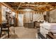Unfinished basement with exposed beams, concrete floor, and ample storage space at 7849 Clearwater Cove Dr, Indianapolis, IN 46240
