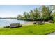 Scenic beach with benches and lush green space, ideal for relaxation and enjoying waterfront views at 7849 Clearwater Cove Dr, Indianapolis, IN 46240