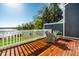 Outdoor deck with comfortable seating offers serene water views for relaxing or entertaining at 7849 Clearwater Cove Dr, Indianapolis, IN 46240