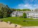 Overhead view of gray townhouse exteriors and beach with lakefront access, all in one place at 7849 Clearwater Cove Dr, Indianapolis, IN 46240