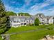 Lush green lawn and pathway complement the gray exterior of these gorgeous townhouses at 7849 Clearwater Cove Dr, Indianapolis, IN 46240