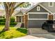 Beautiful front of a well-maintained home with landscaped yard and a private driveway at 7849 Clearwater Cove Dr, Indianapolis, IN 46240