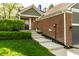 Attractive home with brick facade and landscaped walkway leading to the front door at 7849 Clearwater Cove Dr, Indianapolis, IN 46240