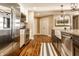 Beautiful kitchen features stainless appliances, white cabinets and hardwood floors at 7849 Clearwater Cove Dr, Indianapolis, IN 46240