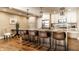 Spacious eat-in kitchen features stainless appliances, white cabinets and a large island with bar seating at 7849 Clearwater Cove Dr, Indianapolis, IN 46240